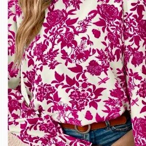 This lovely floral top can be yours!